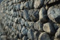 Generative AI Image of Tilt Angle Shot of Dark Natural Rock Stone Wall with Rough Texture Royalty Free Stock Photo