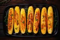 Generative AI Image of Top View of Delicious Roasted Corns Food on Black Plate