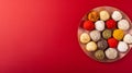 Generative AI Indian traditional sweets various laddu for festival on red background with copy space flat lay busi