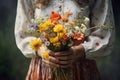 Generative AI International Women& x27;s Day. A young woman in a dress holds a lush bouquet of wild primroses. Close