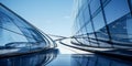 Modern architectural elegance: Upward view of a futuristic skyscraper\'s curved glass facade reflecting the clear blue sky Royalty Free Stock Photo