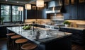 Modern kitchen interior with dark wood cabinets, marble countertops, and stainless steel appliances illuminated by pendant lights Royalty Free Stock Photo