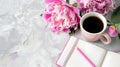 Generative AI Morning coffee mug for breakfast empty notebook pencil and pink peony flowers on white stone table t Royalty Free Stock Photo