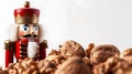 Generative AI Nutcracker on a pile of empty nutshells isolated on white background business concept. Royalty Free Stock Photo