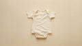 Generative AI Organic cotton bodysuit romper on beige background Baby clothes Fashion newborn clothes Flat lay top Royalty Free Stock Photo