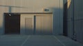 Generative AI Outside view of a small, empty warehouse in an industrial area business concept. Royalty Free Stock Photo