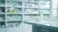 Generative AI pharmacy table counter with blur shelves of drug in the drugstore background For create montage medi Royalty Free Stock Photo