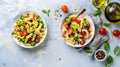 Generative AI Plate and bowl with tasty pasta salad and ingredients on light background business concept. Royalty Free Stock Photo