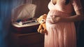 Pregnant_woman_in_dress_with_ultrasound_image_3