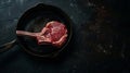 Generative AI Raw fresh meat Tomahawk Steak in Cast iron frying pan on dark background business concept. Royalty Free Stock Photo