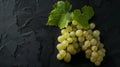 Generative AI Ripe white grapes with leaves on a black background Copy space Flat layTop view business concept. Royalty Free Stock Photo