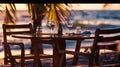 Generative AI Romantic sunset on the shore of a tropical island Cafe on the beach Dinner table business concept. Royalty Free Stock Photo