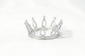 Generative AI a simple metallic crown on a white background Royalty Free Stock Photo