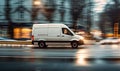 Speeding White Delivery Van in Urban Setting Captures the Fast-Paced Nature of City Logistics and E-commerce Delivery Services