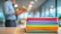 Generative AI Stack of Colorful Paper on Desk in Office Setting with Blurred Background for Professional Use busin Royalty Free Stock Photo