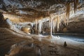 Generative ai on theme of a large beautiful sharp stalactites hanging down from deep mountain cave Royalty Free Stock Photo