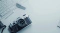 Generative AI top view office table concept with retro camera notebook and keyboard on white Color table backgroun Royalty Free Stock Photo