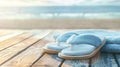 Generative AI Towel and beach slippers on woodsummer background business concept. Royalty Free Stock Photo