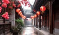 Traditional Chinese courtyard architecture with red lanterns hanging in a serene alleyway, embodying ancient cultural heritage and Royalty Free Stock Photo