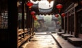 Traditional Chinese courtyard architecture with red lanterns hanging in a serene alleyway, embodying ancient cultural heritage and Royalty Free Stock Photo