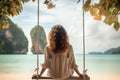 Traveler woman relaxing on swing above Andaman 1 Royalty Free Stock Photo