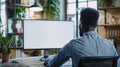 Generative AI Unrecognizable black businessman using computer with empty blank screen sitting at workplace in offi