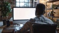 Generative AI Unrecognizable black businessman using computer with empty blank screen sitting at workplace in offi