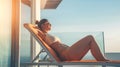 Generative AI woman relaxing in sunbed at penthouse apartment and enjoying summer vacations in Tenerife business c Royalty Free Stock Photo