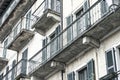Generic balconies on an old house Italy desaturated slightly artistically