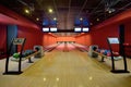 Generic Bowling Alley lanes with bowling ball going towards the pins Royalty Free Stock Photo