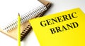 GENERIC BRAND text on yellow paper with notebooks Royalty Free Stock Photo