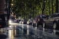 Generic city courtyard with parked cars under heavy rain Royalty Free Stock Photo