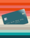 A generic credit card is seen slipped into a pocket between layers of bright colors