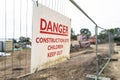 Generic danger sign seen at the boundary of a new housing development site.