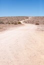 Generic desert scene with road and vehicle Royalty Free Stock Photo