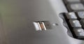 Generic laptop fingerprint scanner sensor module object detail closeup, nobody, no people, shallow DOF Finger sliding finger print