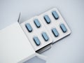 Generic pill pack with blue capsules isolated on gray background. 3D illustration