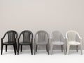 Generic plastic chairs going from black to white Royalty Free Stock Photo