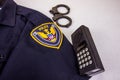 Generic Police Shirt With Handcuffs & Walkie Talkie Royalty Free Stock Photo