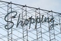 Generic Shopping sign in vintage retro style text, on top of a strip mall in the United States