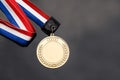 Generic sporting event gold medal with red and blue ribbon Royalty Free Stock Photo