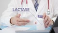 LACTASE, a generic supplement, in the bottle in doctor`s hand