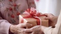 Generous Hands Offering a Gift Wrapped with Love. Generative ai Royalty Free Stock Photo