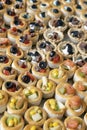 Generous plate of tasty bite-sized canapes, selection of tender vol-au-vent shells and pastry cup
