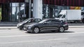 Genesis G80 on the street in motion. Front side view of a premium Korean car, luxury black sedan Royalty Free Stock Photo