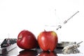 Genetically modified foods, apple pumped with chemicals Royalty Free Stock Photo