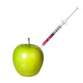 Genetically modified green apple and syringe isolated on white background. GMO food concept Royalty Free Stock Photo