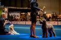 Handler presenting dog during World dog show. Geneva, Switzerland