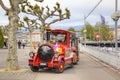 Geneva. Children Road train ashore lake