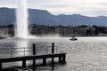 Geneva cityscape pier and Water jet dEau Water Fountain and facades in winter